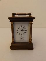 A small 20thC French brass cased alarum carriage clock, 3.2" high excluding dial.