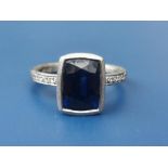 A boxed Malcolm Betts certified 2.98 carat sapphire & diamond ring, the collet set rectangular