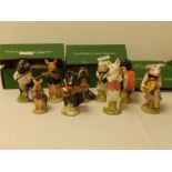 A nine piece Beswick pig band in original boxes.