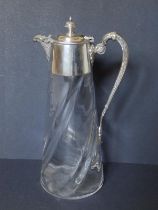 An early 20thC EP mounted wrythen moulded glass claret jug, 11" high.