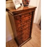 An early Victorian walnut veneered Wellington chest.