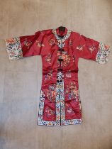 A mid 20thC Chinese robe in embroidered red & white silk.