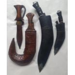 A middle Eastern jambiya and three otherr Eastern weapons. (4)