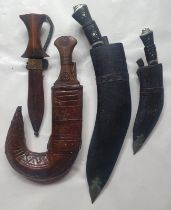 A middle Eastern jambiya and three otherr Eastern weapons. (4)