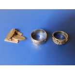 A pair of oval 9ct gold cufflinks and two 9c bands. (3)