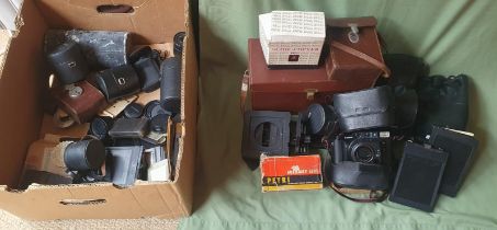 A collection of vintage cameras, accessories, cases & lens covers.