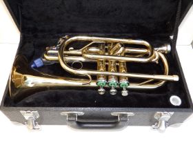 An Earlham brass trumpet in fitted case.