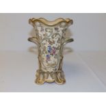 A Victorian porcelain two-handled vase decorated in flowers with gold & grey scrolls, 7.25" high.
