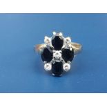 A sapphire & diamond paste 9ct gold cluster ring. Finger size O.