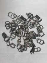 A collection of excavated medieval and later buckles.