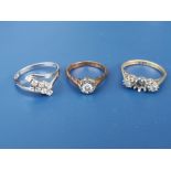 An illusion set diamond solitaire ring in 18ct gold and two other diamond rings - one missing stone.