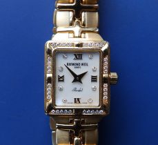 A boxed, lady's diamond set 18ct gold Raymond Weil 'Parsifal' bracelet wrist watchwrist watch with
