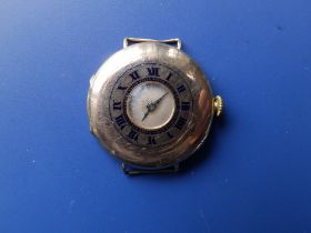 An early 20thC 9ct gold half hunter wrist watch, case diameter 30mm.