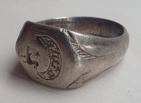 A large 15thC silver seal ring, the engraved bezel depicting a bird inscribed 'Uture', presumably