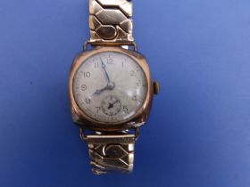 An early 20thC gent's 9ct gold Leda wrist watch on plated strap - case bruised.