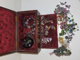 A mahogany jewellery box and contents.