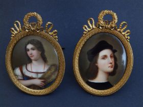 A pair of 19thC German porcelain oval plaques painted in enamels with miniature portraits, in