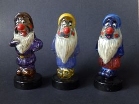 Three 'Seven Dwarfs' glass character scent bottles by Elizabeth Saxon, circa 1960.