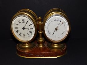 A twin dial brass clock/barometer on red marble base, 6.25" across.