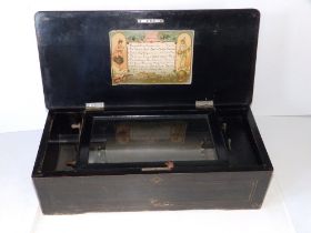 A late 19thC Swiss cylinder music box, the 8" barrel playing eight airs, tune sheet to lid