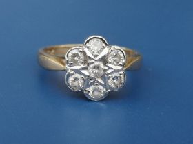 A 9ct gold diamond daisy cluster ring. Finger size K/L.