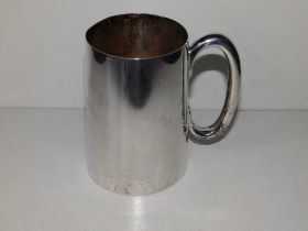 A plain silver tankard of tapering cylinder form retailed by Harrods - RWB, London 1943, 4.75"
