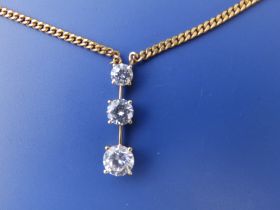 A three stone cubic zirconia drop pendant on 9ct necklace chain