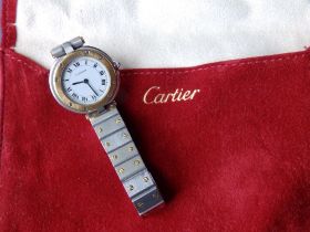 A lady's bi-metal Santos de Cartier quartz bracelet wrist watch, case diameter 28mm.