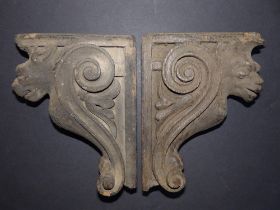 A pair of antique carved oak corbels, believed to have been removed during the dismantling of the