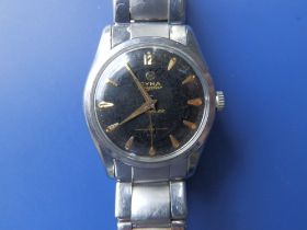 A gent's Cyma black dial Navystar Cymaflex bracelet wrist watch with subsidiary seconds.