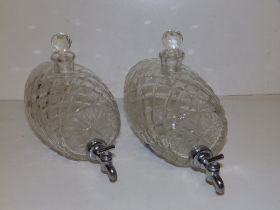 A pair of cut glass spirit barrels, 6" across. (2)