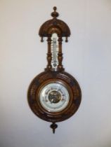 A small Victorian banjo barometer with enamelled dials. 18" high.