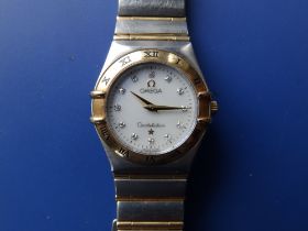 A boxed lady's stainless steel & gold Omega Constellation bracelet wrist watch, with mother-of-pearl
