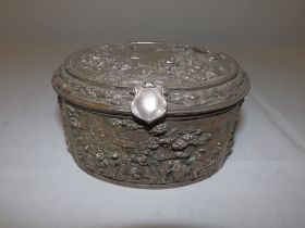 A continental plated oval jewellery box with hinged cover, decorated in high relief with 17thC style