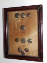 A small framed display of ten 18thC Danish metal buttons, including Frederick IV examples -