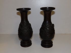 A pair of Oriental bronze vases, signed to undersides. (2)