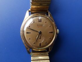 A gent's 18ct gold Richard Automatic wrist watch with gold dial, subsidiary seconds, on plated
