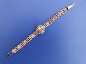 A lady's 9ct gold 'Helvetia' bracelet wrist watch with concealed dial.