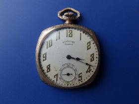 A gold plated Standard Watch Co. 'Keystone' pocket watch in cushion shaped case, with subsidiary