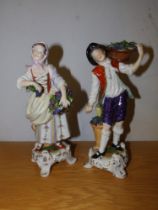 A pair of Ludwigsburg porcelain figures - fruit & flower sellers, underglaze blue crowned marks,