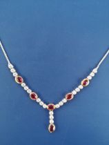 A modern ruby & diamond set necklace in 18ct white & yellow gold, comprising six oval cut rubies