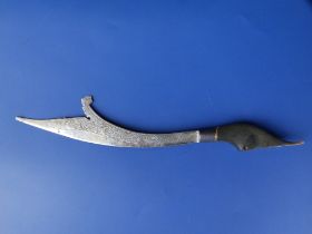 An Eastern horn-handled knife with curved white metal blade, 9.75" overall - handle re-stuck.