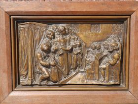 A Victorian framed bronze relief plaque, modelled to depict a church interior with a choir