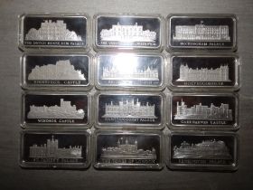 A set of 12 Birmingham Mint Royal Palace commemorative silver ingots, 2" across.