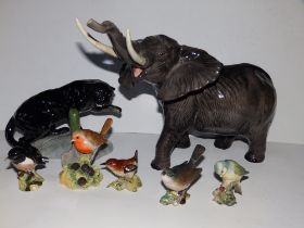 A Beswick elephant with repaired tusk, 10" high, a panther 1823 and five small Beswick birds - one