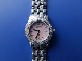 A boxed lady's diamond set stainless steel Ingersoll Quartz bracelet wrist watch with mother-of-