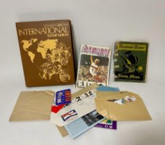 A Stanley Gibbons International Stamp Album, loose postage stamps and others.