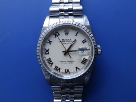 A boxed gent's stainless steel Rolex Datejust 160 with cream dial, Roman numerals, on Jubilee