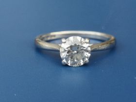 A diamond solitaire ring, the four claw set brilliant weighing approximately one carat, on
