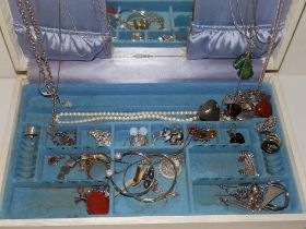 A jewellery box containing silver & costume jewellery.